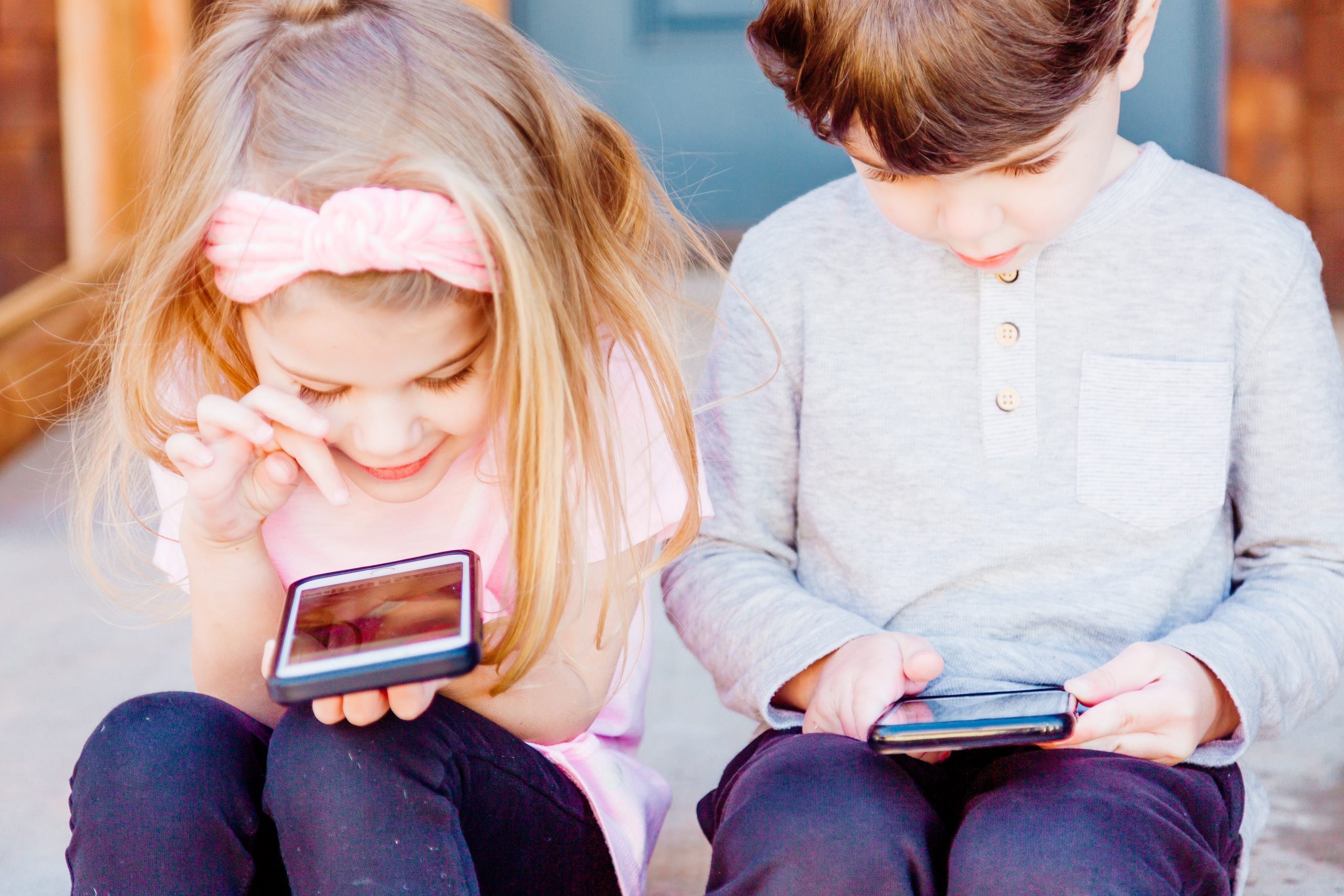 Kids using smartphones and looking at social media